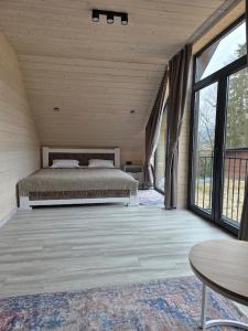 Ένα ή περισσότερα κρεβάτια σε δωμάτιο στο Спас Резорт