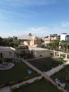 an aerial view of a house with a yard at Leyla Eco Resort Queen Suites in Luxor