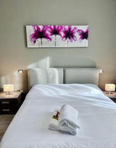 Ένα ή περισσότερα κρεβάτια σε δωμάτιο στο Mavin Apartments Cuneo