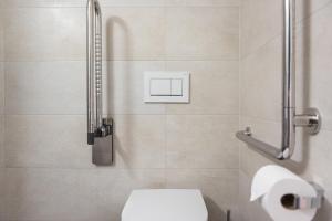 a bathroom with a toilet and a shower at STAYY Nº7 Suites & Studios -Self Check-in in Zürich +63 photos