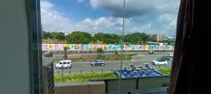 a view from a window of a parking lot with cars at HOTEL MAHER Inn in Ahmedabad +29 photos