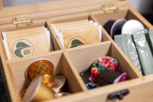 a wooden drawer filled with boxes filled with items at STAYY Nº7 Suites & Studios -Self Check-in in Zürich