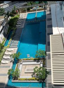 an overhead view of a swimming pool on a building at Simple White Scape at Mesavirre Bacolod in Bacolod