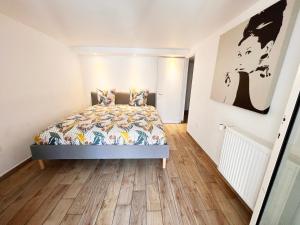 Una cama o camas en una habitación de 2 pièces cosy à 15 min de Paris