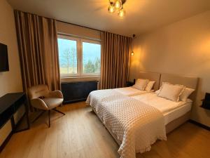 Ένα ή περισσότερα κρεβάτια σε δωμάτιο στο Zajazd Kasztelański