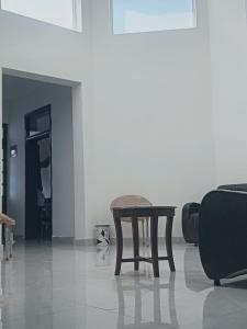 a coffee table in a room with a white wall at Paris pines Muree Bhurban in Bhurban