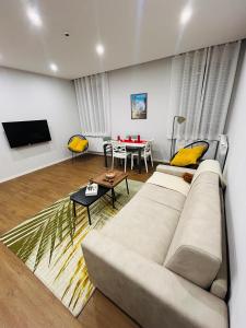 a living room with a couch and a table at AB apartment Pistoia in Pistoia +24 photos