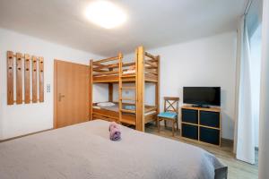 Кровать или кровати в номере Apartment AUTHORIA