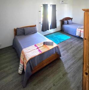 Ένα ή περισσότερα κρεβάτια σε δωμάτιο στο Chill Paradise