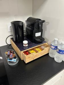 a coffee maker sitting on top of a counter at Le 147 Parc Entre Paris et Disney in Champigny-sur-Marne