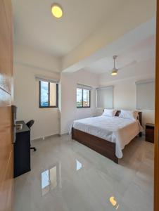 Ένα ή περισσότερα κρεβάτια σε δωμάτιο στο Prado Garden Hotel +5 φωτογραφίες