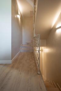 an empty hallway with stairs in a house at NEW Casa Florentia in Ambrogiana