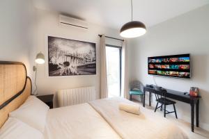 En eller flere senge i et værelse på Alemaison Diseño y Confort Piscina Privada + 14 billeder