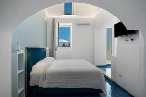 Ένα ή περισσότερα κρεβάτια σε δωμάτιο στο Blue View Luxury Rooms
