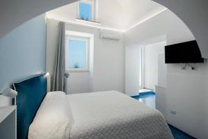 Ένα ή περισσότερα κρεβάτια σε δωμάτιο στο Blue View Luxury Rooms