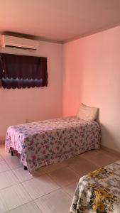 a bedroom with two beds in a room at JR POUSADA in Morro do Chapéu