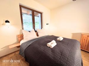 Postel nebo postele na pokoji v ubytování Alpen Panorama 2 - Lachtal Apartments