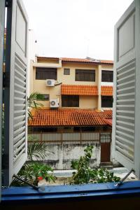 a view from an open window of a building at Betel Box Backpackers Hostel in Singapore