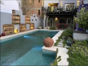 a swimming pool in front of a house at Ostende frente al mar in Ostende