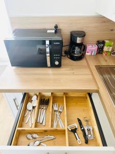 Nhà bếp/bếp nhỏ tại Premium T2 centre ville, 15 min futuroscope