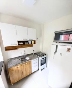 Kuchyň nebo kuchyňský kout v ubytování Pé na areia, 1 quarto, 02 Ares Splits e Garagem