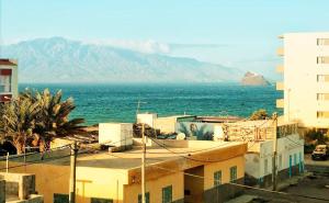 a city with a view of the ocean and mountains at Ocean View Studio in Lazareto
