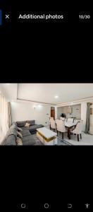 a living room with a couch and a table at 2bedroom house along waiyaki way in Nairobi