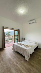 En eller flere senge i et værelse på Pousada Canto Da Ribeira