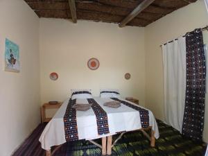 Ένα ή περισσότερα κρεβάτια σε δωμάτιο στο Lompoul Nature