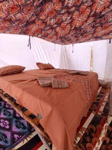 Ένα ή περισσότερα κρεβάτια σε δωμάτιο στο Lompoul Nature +27 φωτογραφίες