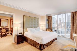 a bedroom with a large bed and a large window at MGM Signature-09-821 1Br2Ba F1 Strip View Balcony Suite in Las Vegas