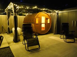 a room with a round tent with chairs and lights at 八ヶ岳ココの家 in Hokuto