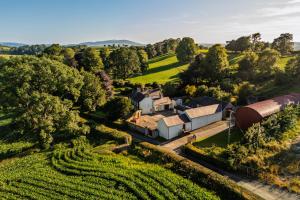 an aerial view of a farmhouse in a vineyard at Tullymurry House in Ardarragh