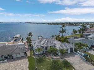 an aerial view of a house and the water at Coastal River Oasis in Cape Coral