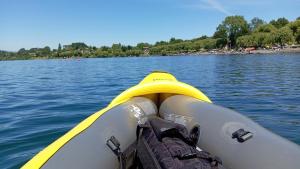 a view of the front of a kayak on a lake at Entre lagos Departamento in Puyehue