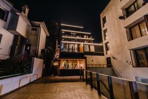 a view of a building at night at KalaMar Hotel in Viña del Mar