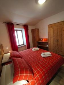 Ένα ή περισσότερα κρεβάτια σε δωμάτιο στο Appartamento Nido