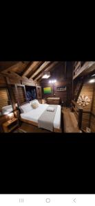 a bedroom with a large bed in a attic at Casa do Sossego in Florianópolis