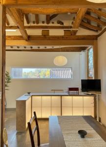 a kitchen and dining room with a table and chairs at seoul hanok stay moonee in Seoul