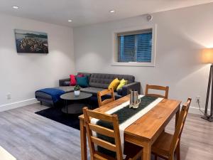 a living room with a table and a couch at A&A Resident in North Vancouver +24 photos