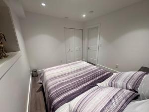 a bedroom with two beds in a room at A&A Resident in North Vancouver