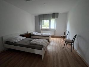 Ένα ή περισσότερα κρεβάτια σε δωμάτιο στο Waldkappel Bergblick