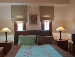 En eller flere senge i et værelse på Villa Marga Luxury Retreat