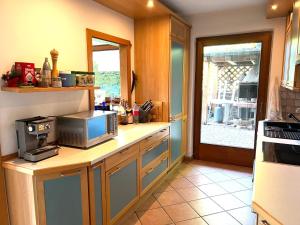 Kuchyň nebo kuchyňský kout v ubytování Villa Grumes by Sunhome Fiemme