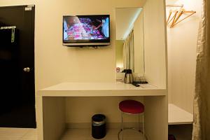 TV a/nebo společenská místnost v ubytování Seven Hotel