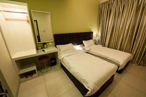 Postel nebo postele na pokoji v ubytování Seven Hotel