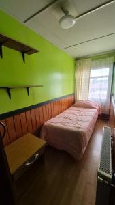 Postel nebo postele na pokoji v ubytování Leyna's Home