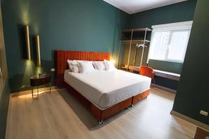 Postel nebo postele na pokoji v ubytování Olivar House Hotel