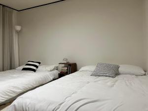 En eller flere senge i et værelse på Nangok Sillim KyungIn Edu Seoul National University Sindaebang