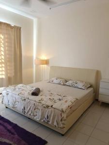 Ένα ή περισσότερα κρεβάτια σε δωμάτιο στο Homestay Bajet EM3 Pantai Damai 2